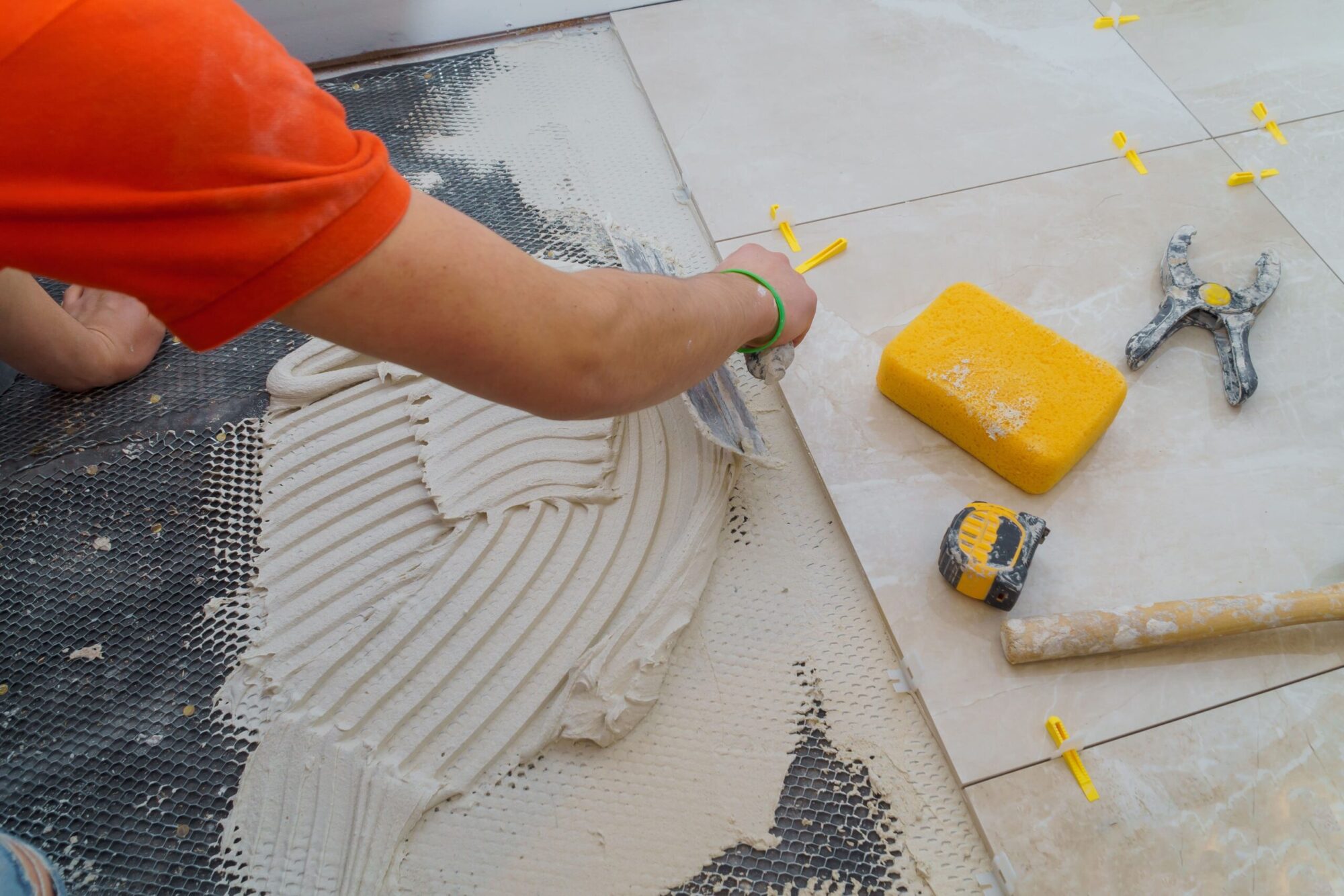 applying-new-tiles-on-bathroom-floor-tile-installa-2026-01-09-08-59-11-utc