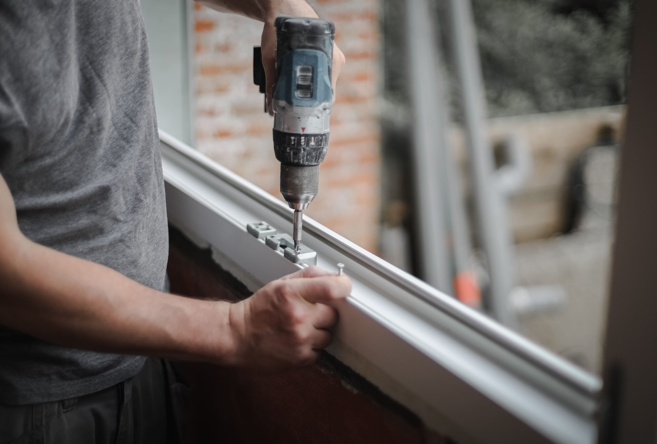 caucasian-man-installs-fittings-for-a-window-frame-2026-01-08-06-11-29-utc