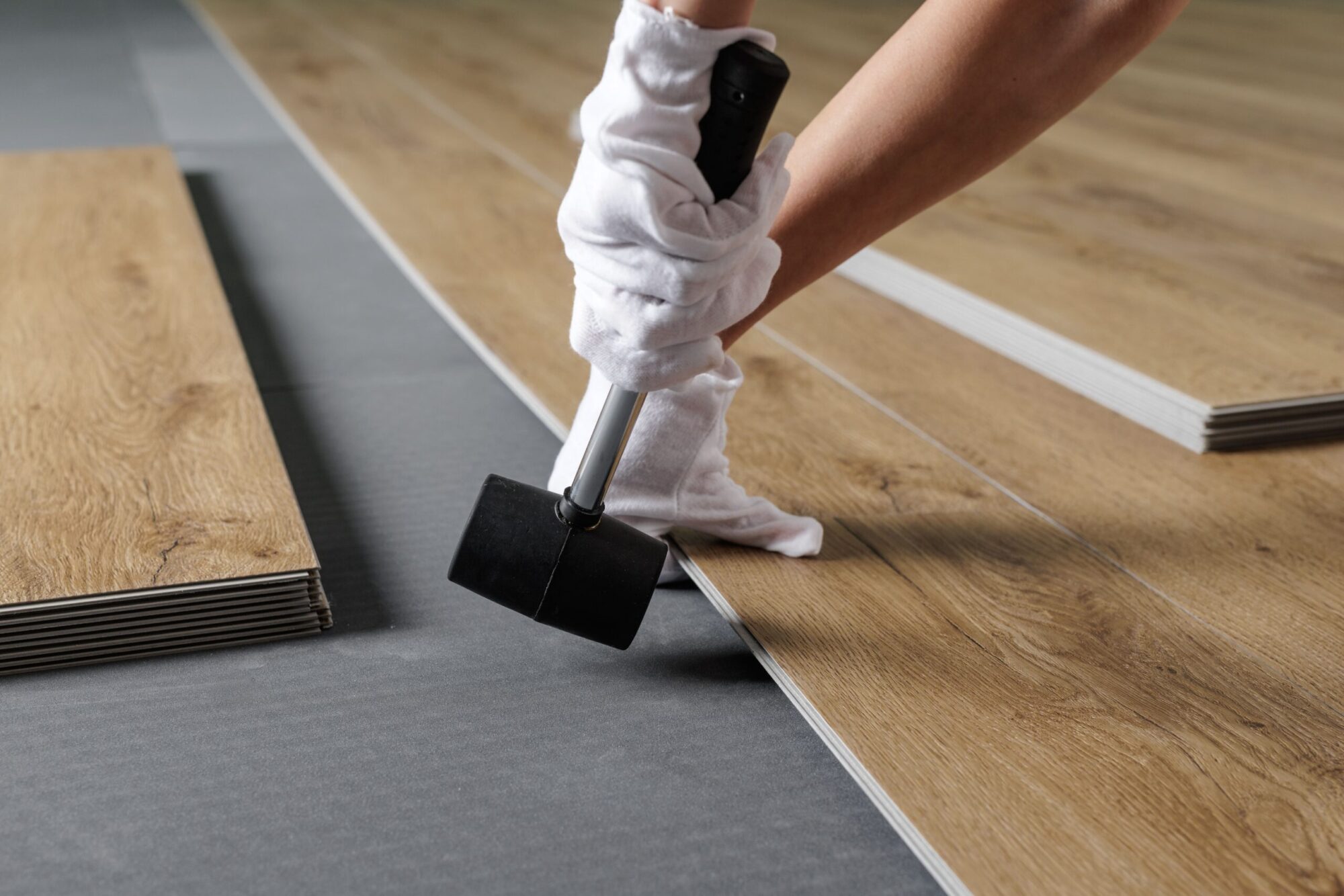 close-up-aligning-spc-vinyl-plank-on-underlayment-2026-01-09-12-13-26-utc