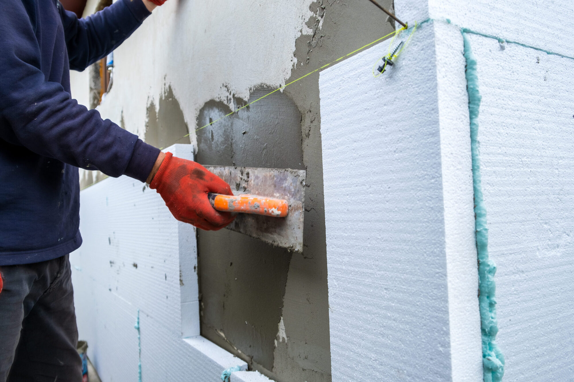 construction-worker-installing-styrofoam-insulatio-2026-01-07-02-13-45-utc