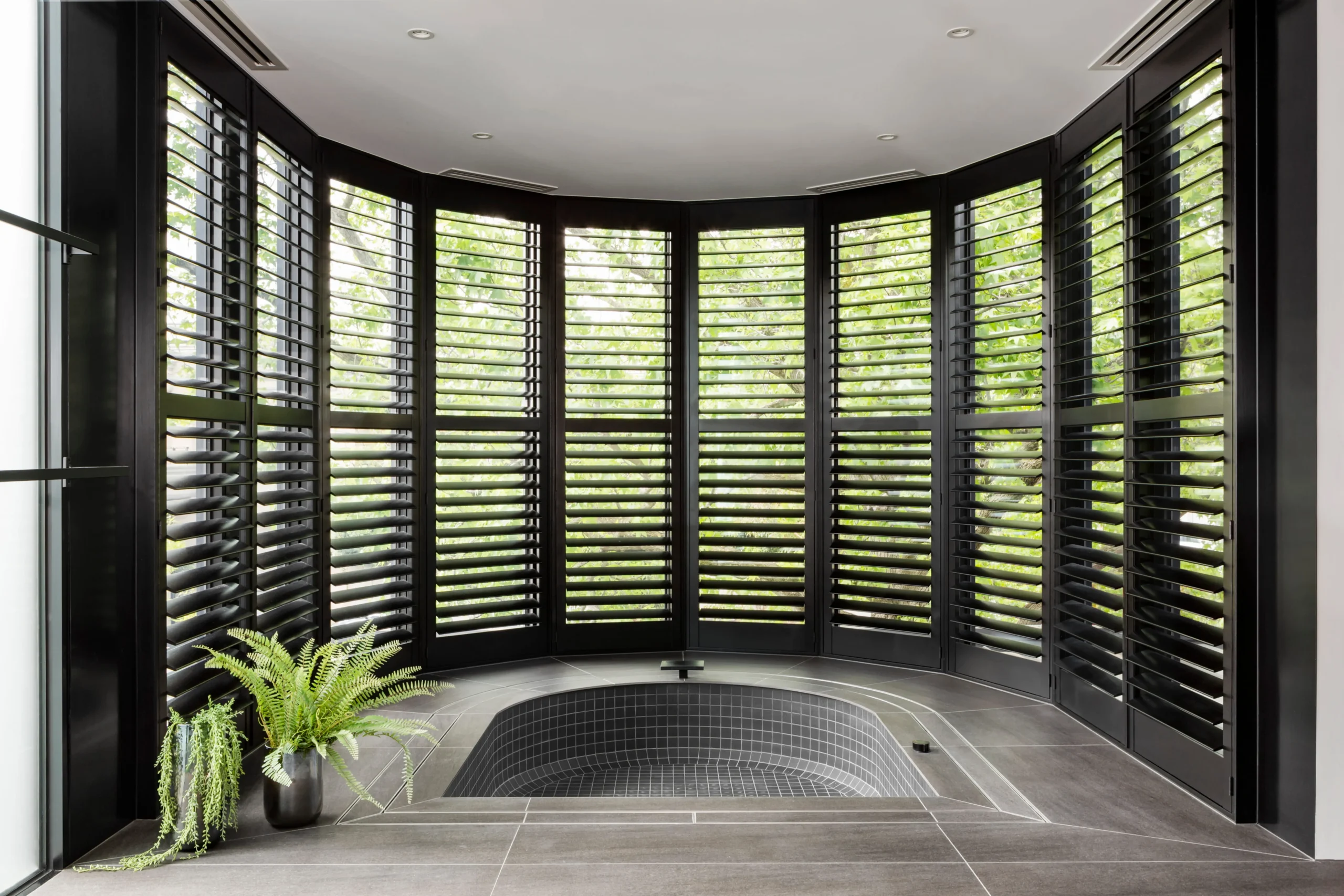 bathtub-next-to-shutters-with-a-view-of-nature-2026-03-09-03-26-42-utc (1)
